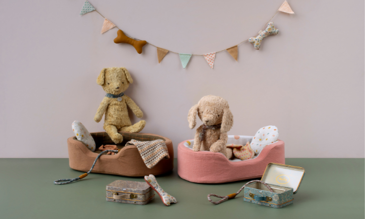 maileg puppies laying in dog beds