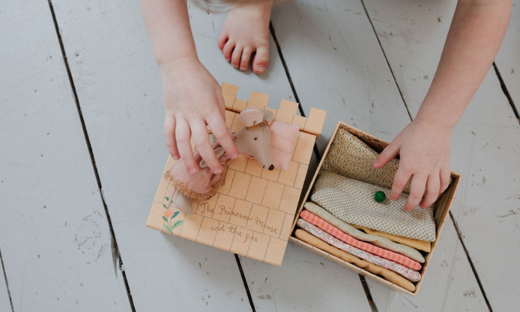 child playing with maileg princess and the pea
